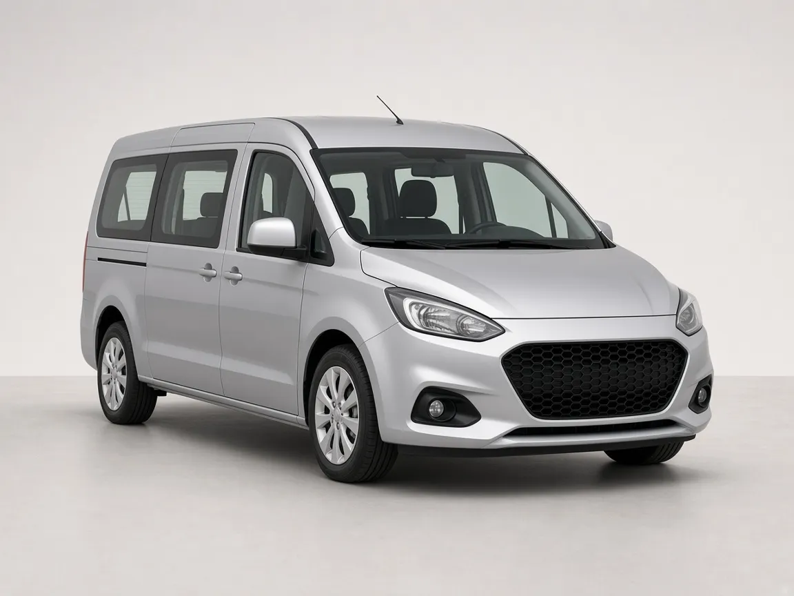 Silver seven seat passenger van with a sliding side door.